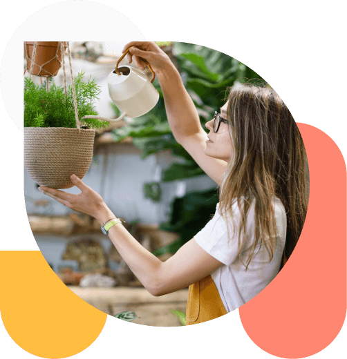 Woman watering plant